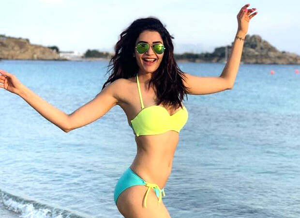 Karishma Tanna gets her beach mode on and rocks in a fluorescent bikini